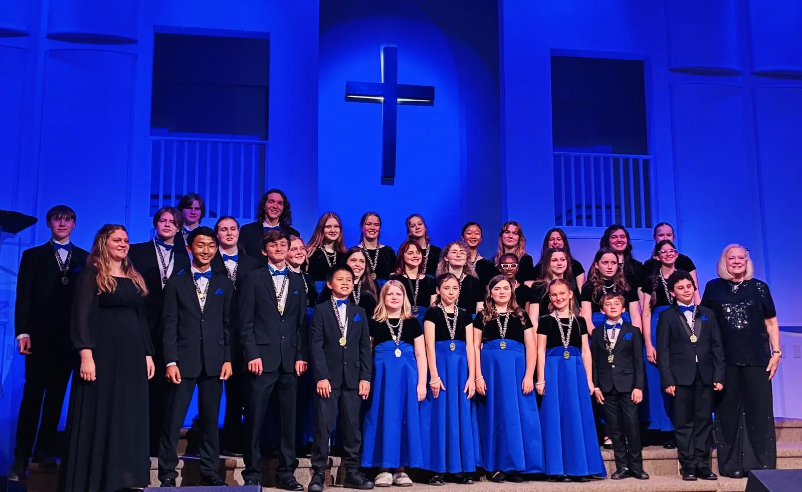 The full Salisbury Children's Choir on stage in concert dress